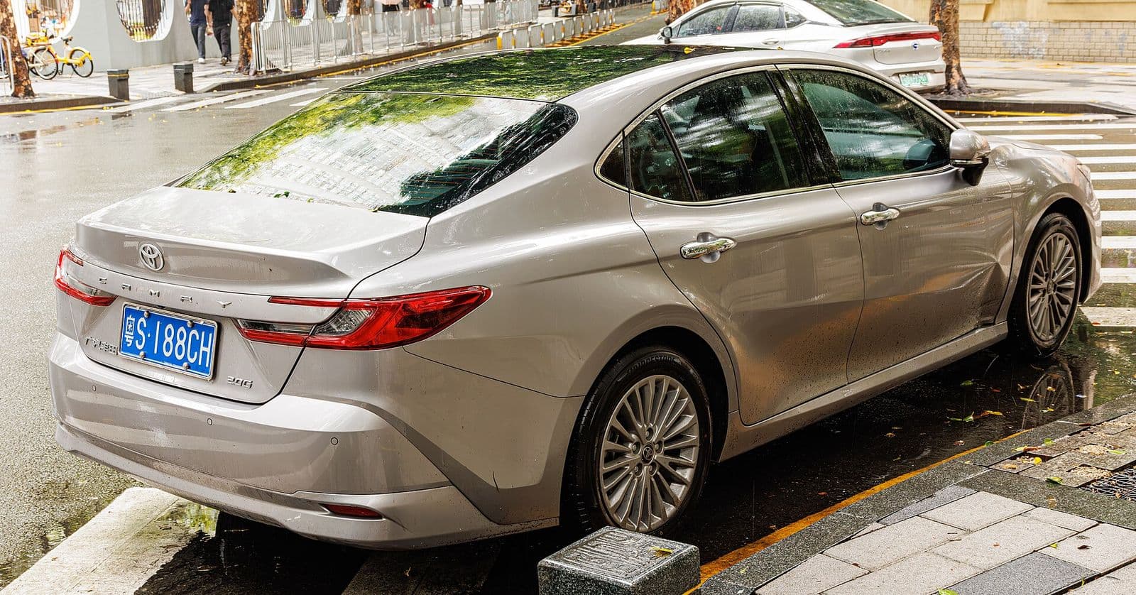 Silver Toyota Camry XV80, rear three-quarter view — current-generation used Camry
