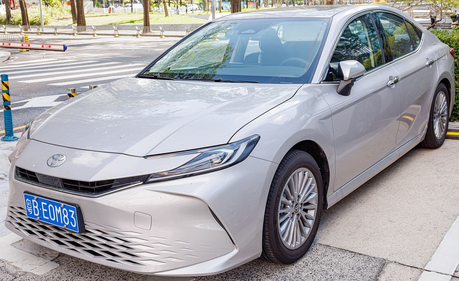 2027 Toyota Camry — China-market Toyota Camry XV80 in silver, front three-quarter view — sedan for export
